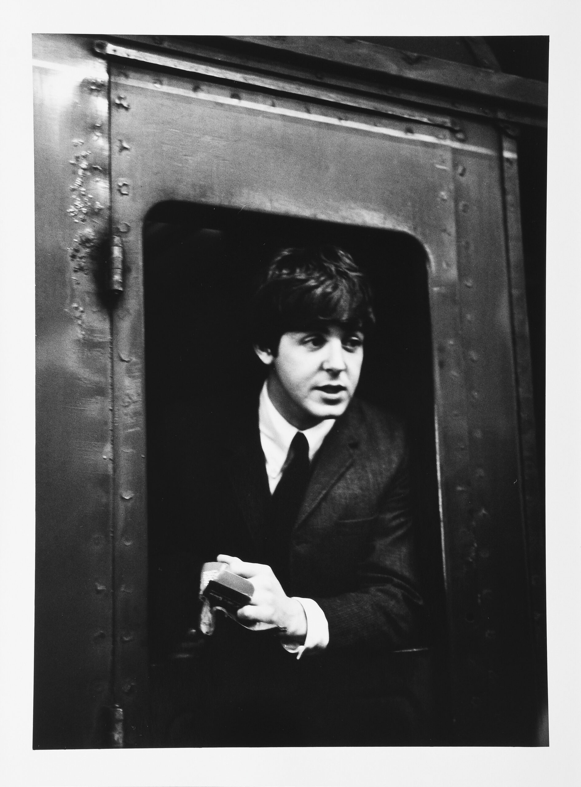 Paul McCartney on a train at Marylebone Station by Lord Cristopher Thynne